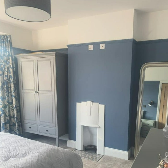 Little Greene Juniper Ash No. 115 is an attractive muted blue paint colour. Order Little Greene Juniper Ash paint online in Ireland. Intelligent Matt Emulion in a bedroom. 