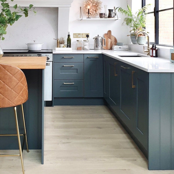 Kitchen cabinets painted in Satinwood Squid Ink 698 Paint and Paper Library. 