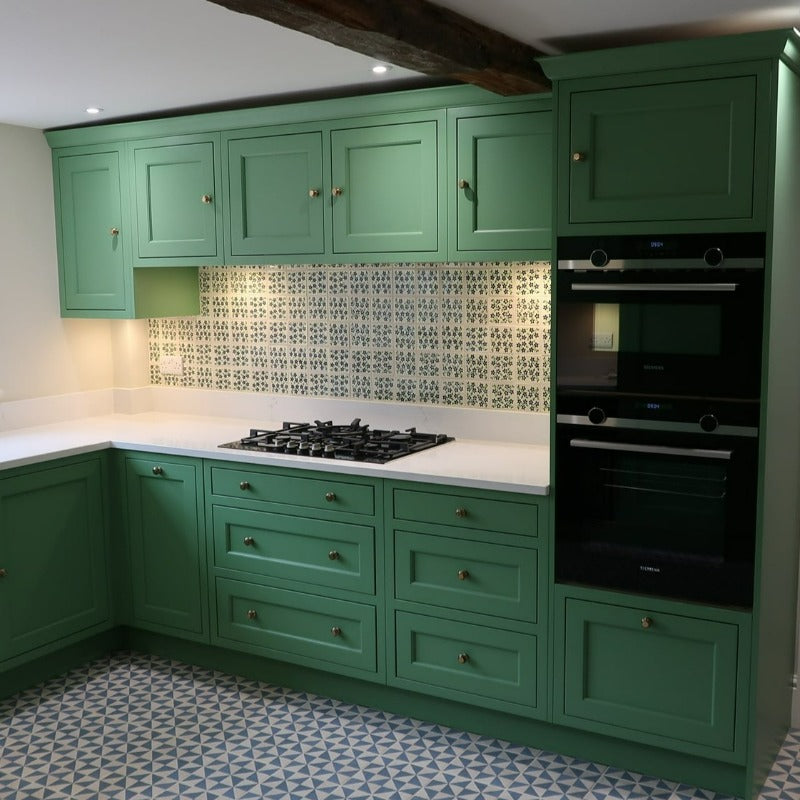 Folly Green No. 76 from Farrow & Ball is a strong but soothing green paint colour. Folly Green No. 76 Farrow & Ball living kitchen cabinet paint colour.