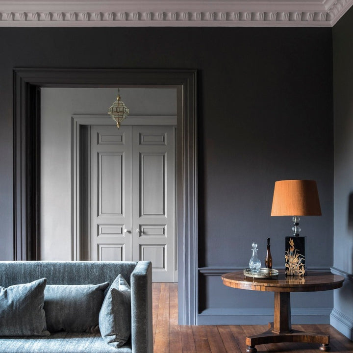 Living room walls painted in Squid Ink 698 Paint and Paper Library.