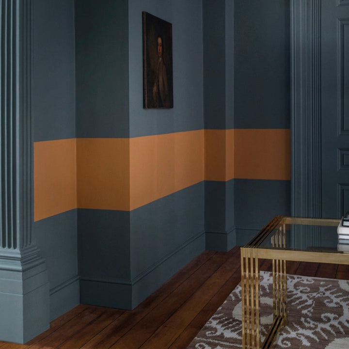 Living room walls painted in Squid Ink 698 Paint and Paper Library.