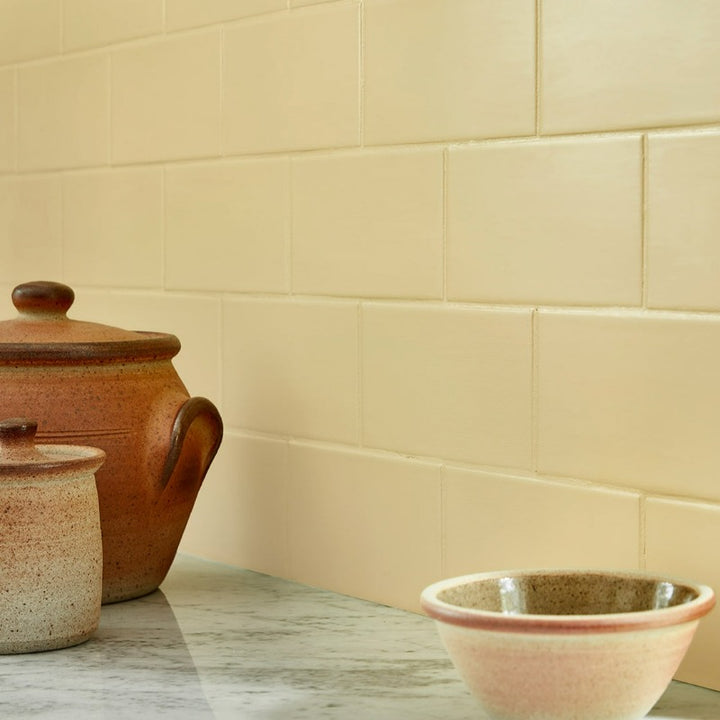 Little Greene Sunlight No. 135 is a beautiful yellow paint colour. Sunlight 135 yellow painted tiles. Buy Little Greene Sunlight 135 paint online.